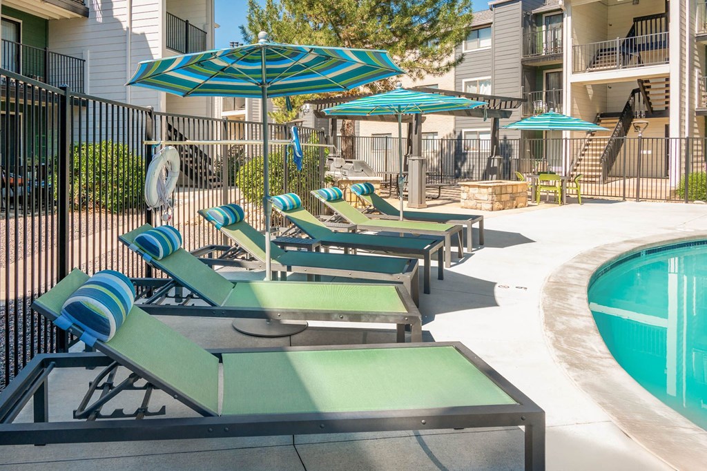 a kitchen and dining room with white cabinets and stainless steel appliances