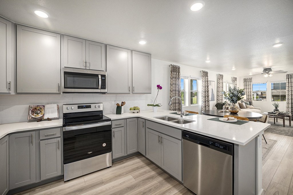 Kitchen with stainless steel appliances and quartz counter tops