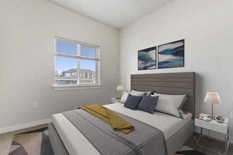 a bedroom with a large bed and a large window