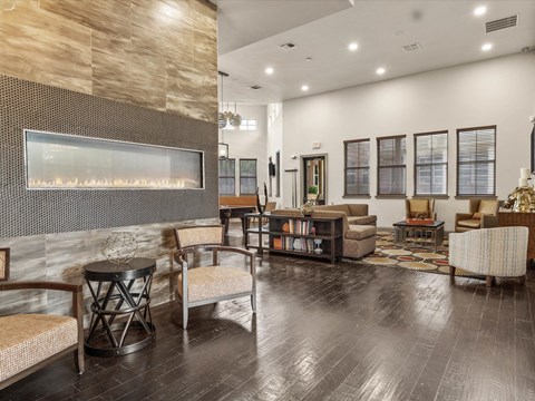 a large living room with a fireplace and furniture