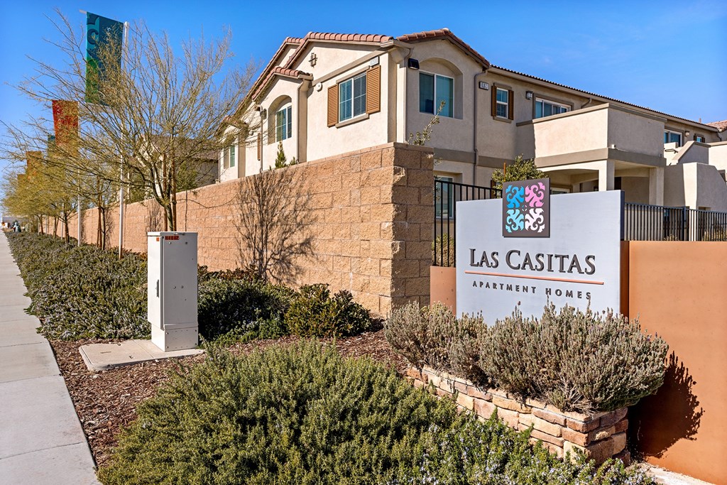 a building with a sign for the las casitas municipal hotel