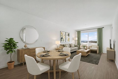 A dining room with a round table and chairs.