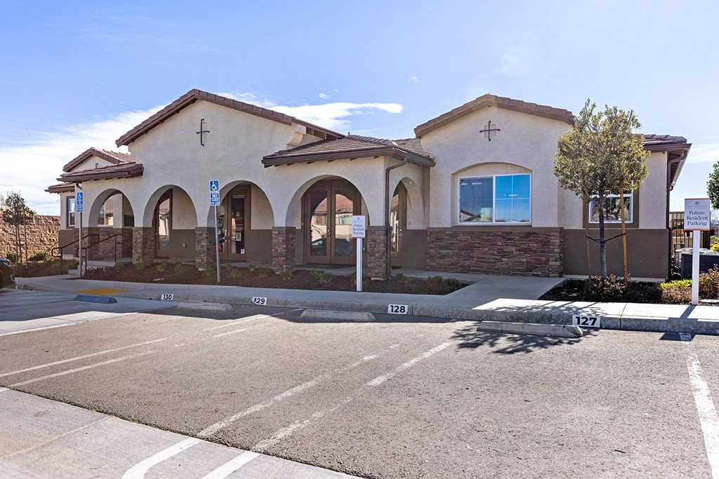 a church building with a parking lot in front of it