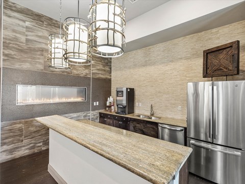 a kitchen with stainless steel appliances and a counter top