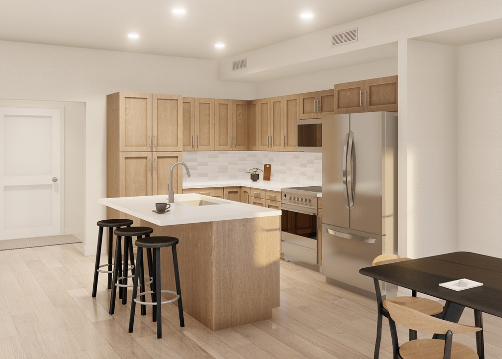 A modern kitchen with wooden cabinets and stainless steel appliances.
