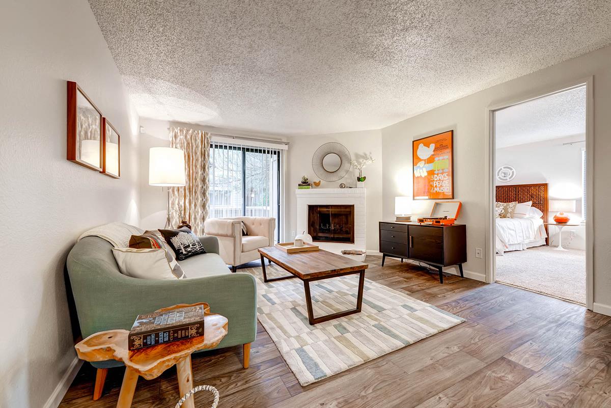 Living Room with sliding patio doors, fireplace and view into the master bedroom
