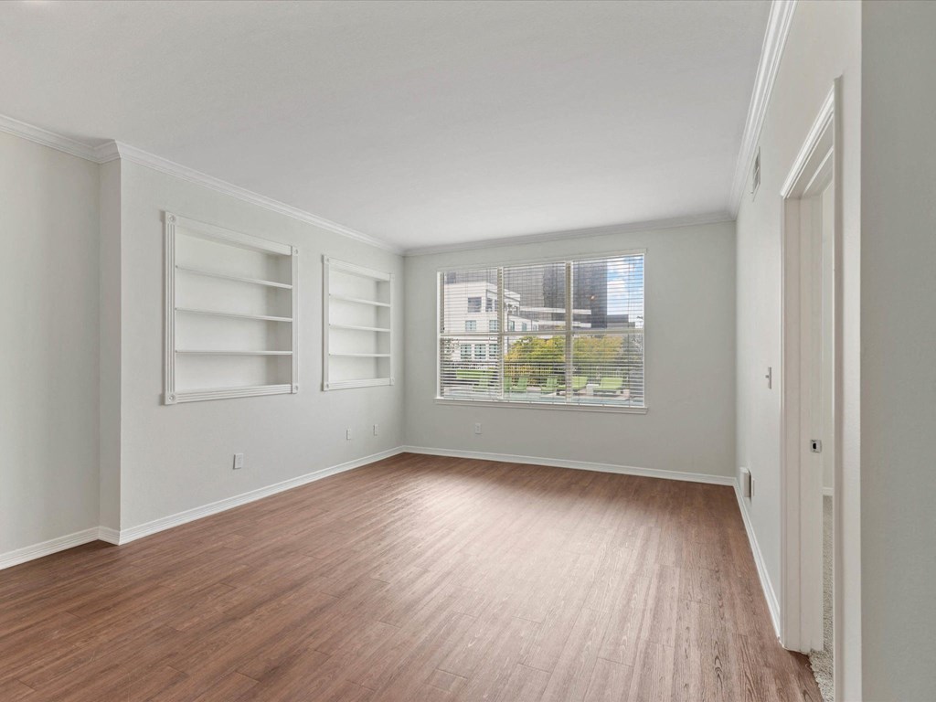 living area with built in book shelves