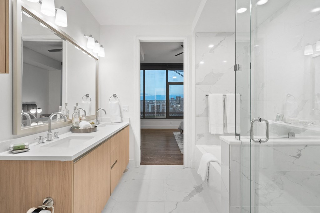 a bathroom with a large window and a glass shower at Stanza Little Italy, San Diego, CA, 92101