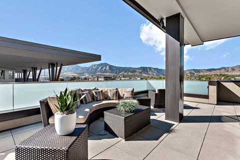 a terrace with a view of a body of water