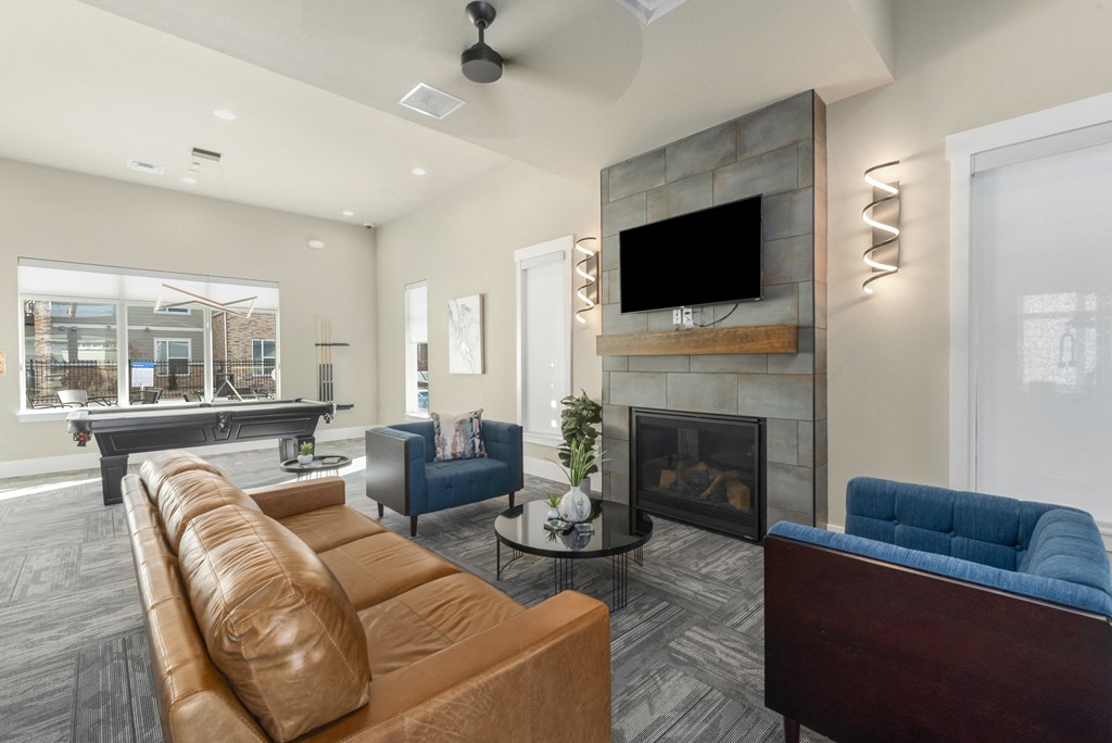 the retreat apartments l living room with fireplace and tv