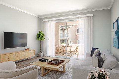 A living room with a flat screen TV, a wooden cabinet, a sofa, a coffee table, and a balcony with chairs.