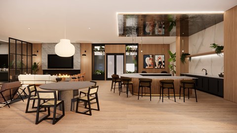 A modern kitchen with a dining table and chairs.