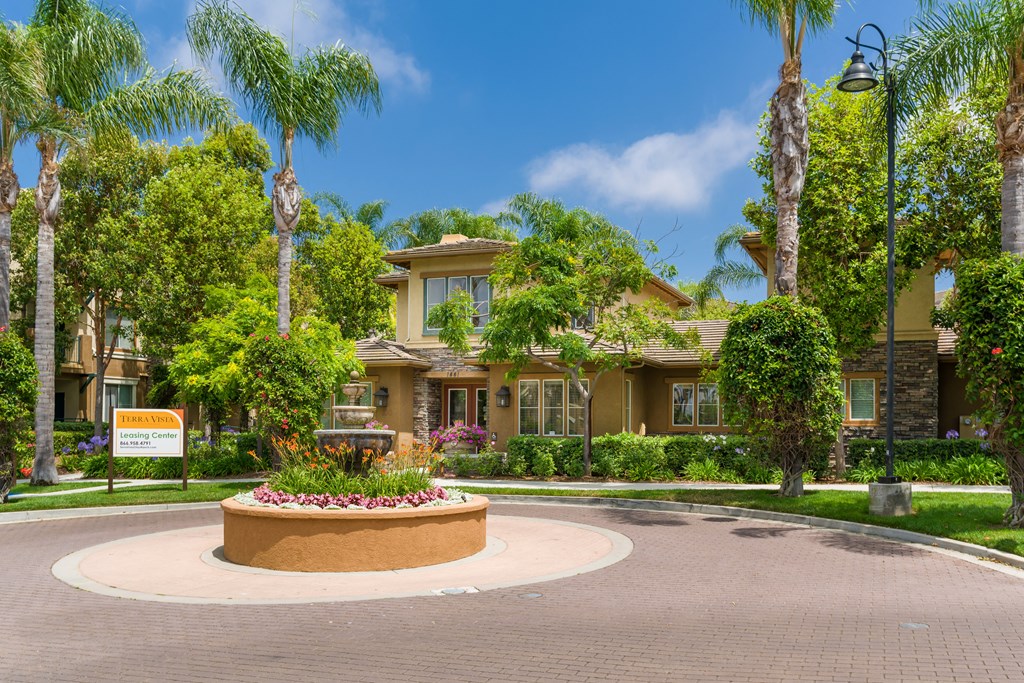 A beautifully landscaped entrance to a residential community.