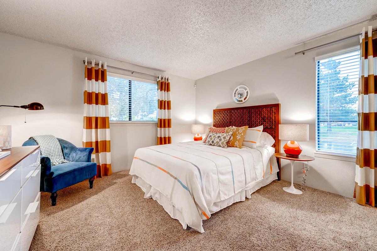 Master Bedroom with bed, dresser, chair and end tables