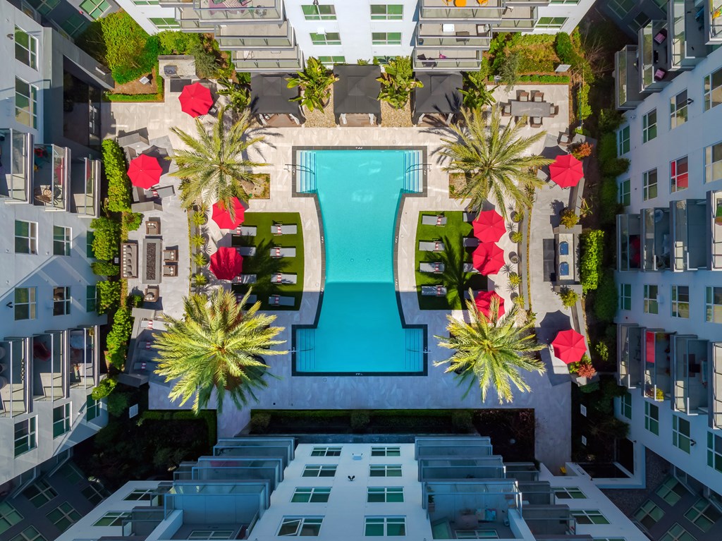 a view of a pool from above at Vora Mission Valley with palm trees at VORA LUX, San Diego, 92120