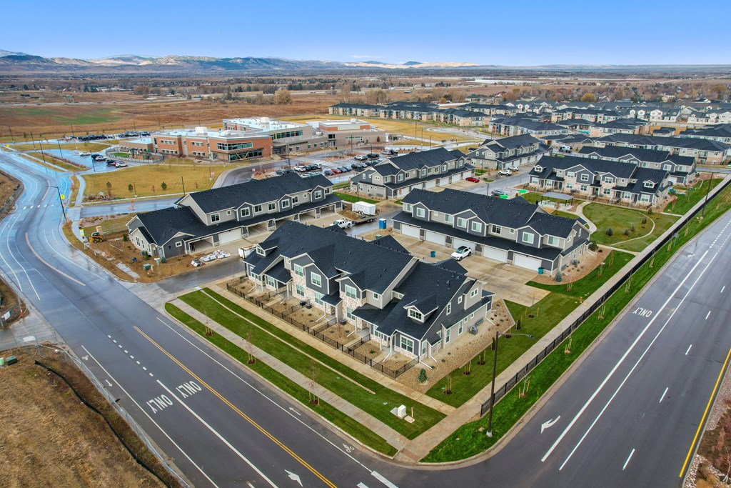 a group of houses sitting on the side of a road