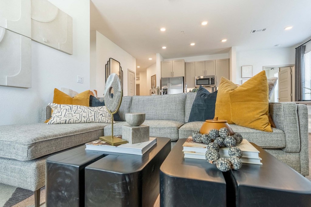 a living room with couches and a table