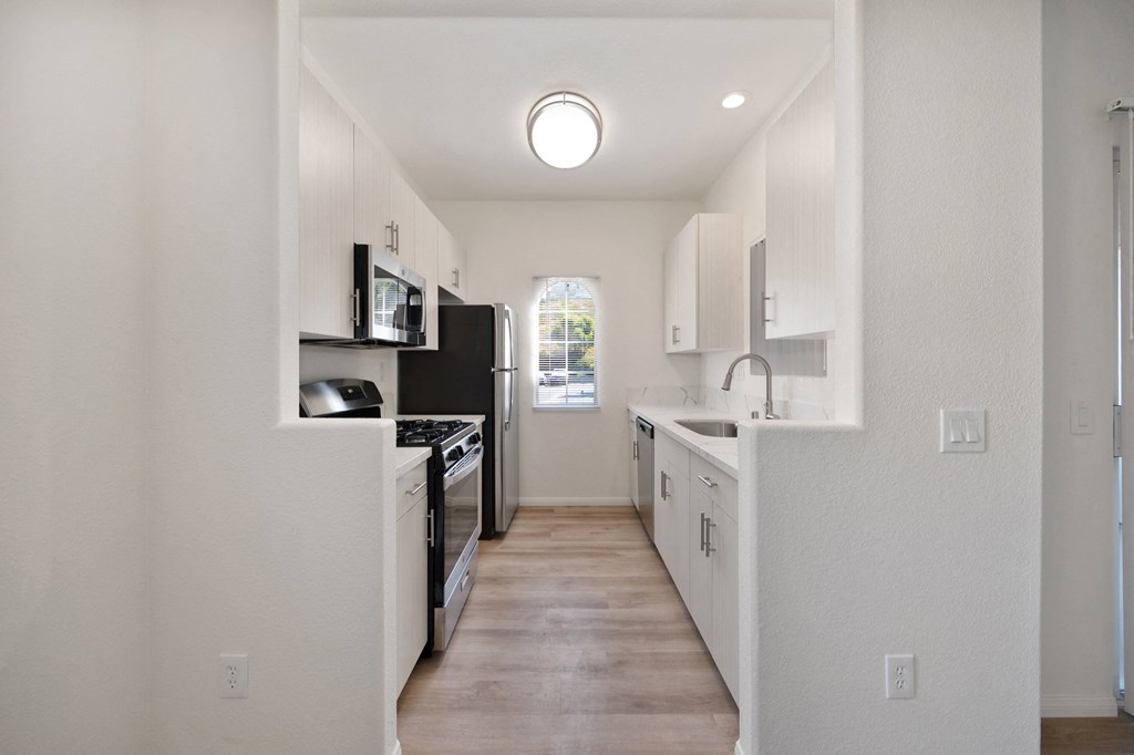 A kitchen at The Landing at Ocean View Hills Apartments