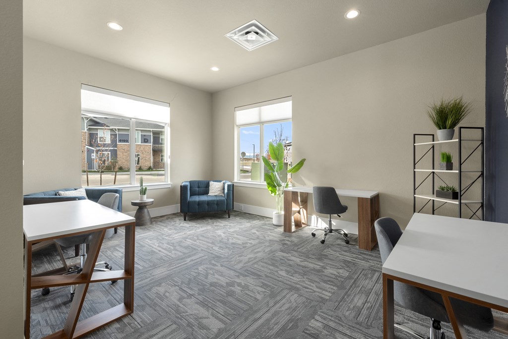 an office with a desk and a chair and a window