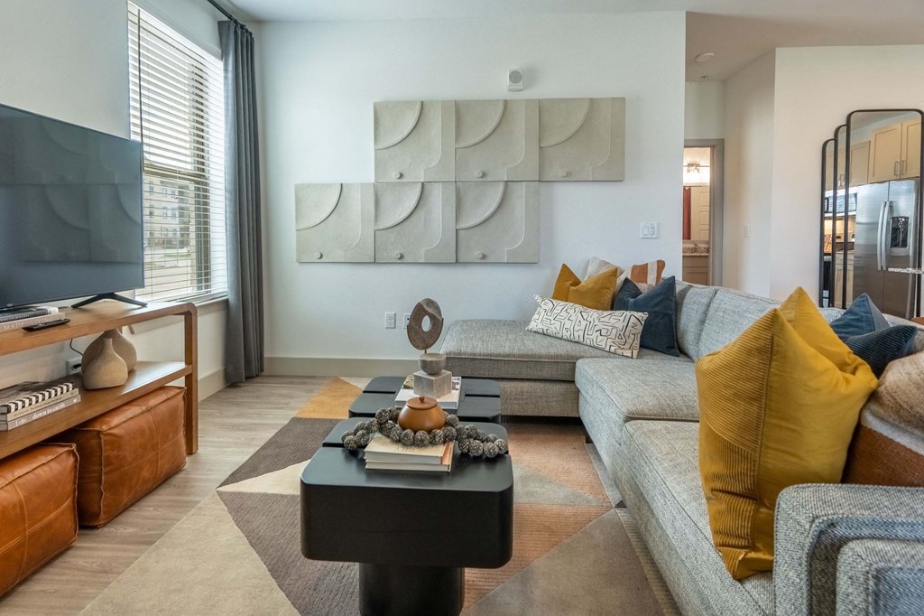 a living room with couches and a coffee table