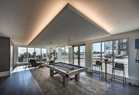 clubhouse with pool table, lounge seating, and with ocean views