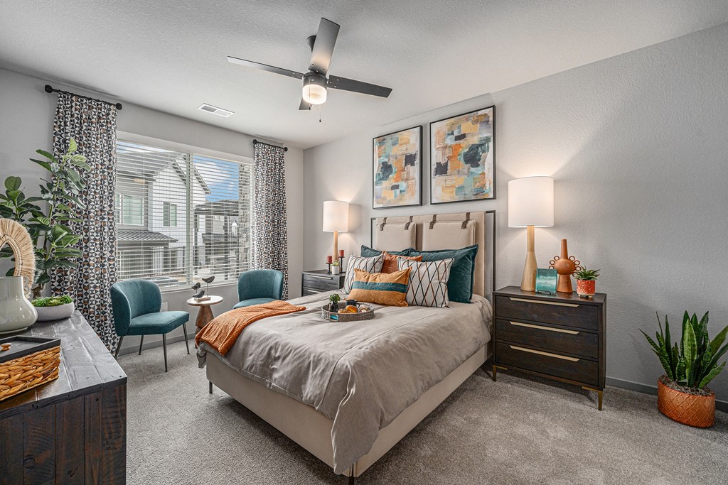 Bedroom with a ceiling fan and carpet flooring