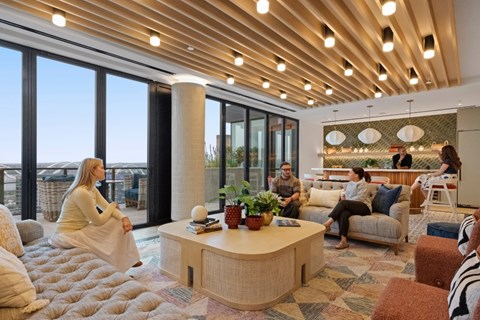 A group of people are sitting in a modern living room.