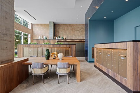 A modern dining room with a wooden table and chairs.