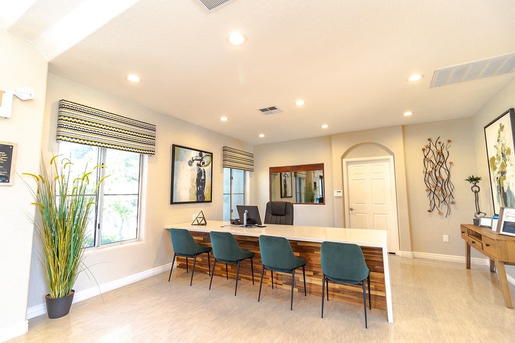 a conference room with a long table and chairs