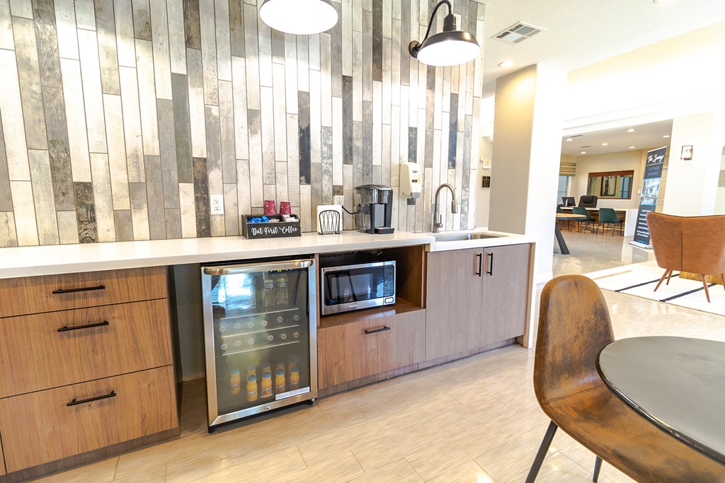 a kitchen with a fridge and a microwave