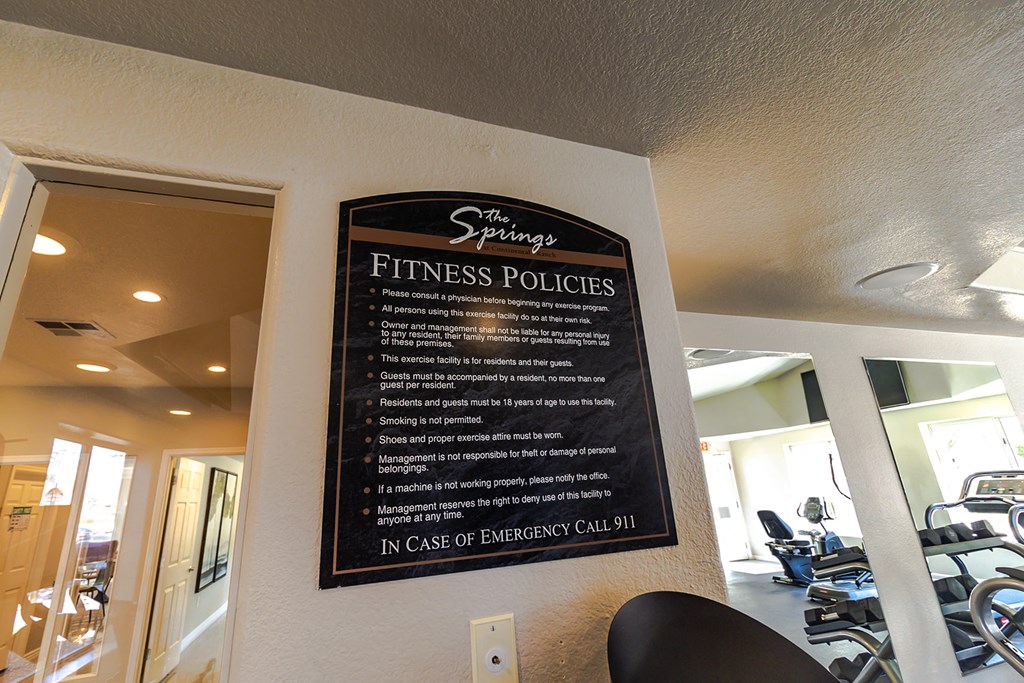 a sign on the wall of a gym