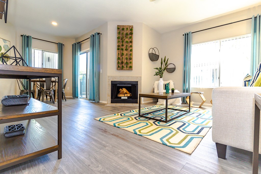 a living room with a fireplace and sliding glass doors