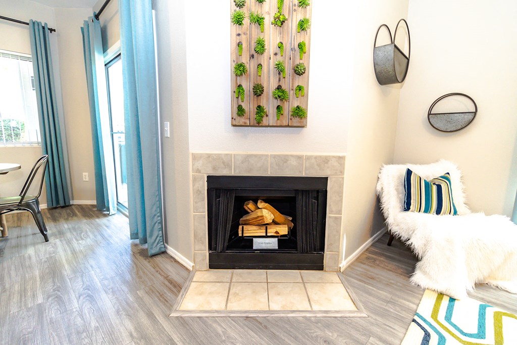 a living room with a fireplace and a couch