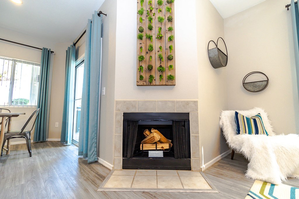 a living room with a fireplace and a couch