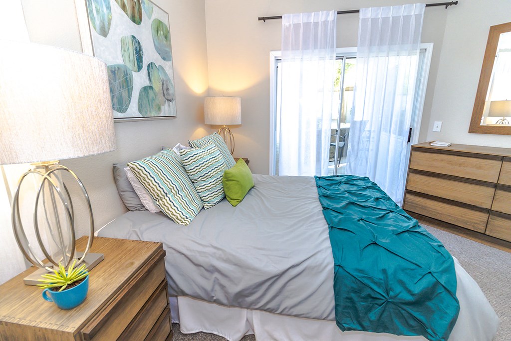 a bedroom with a bed and a dresser