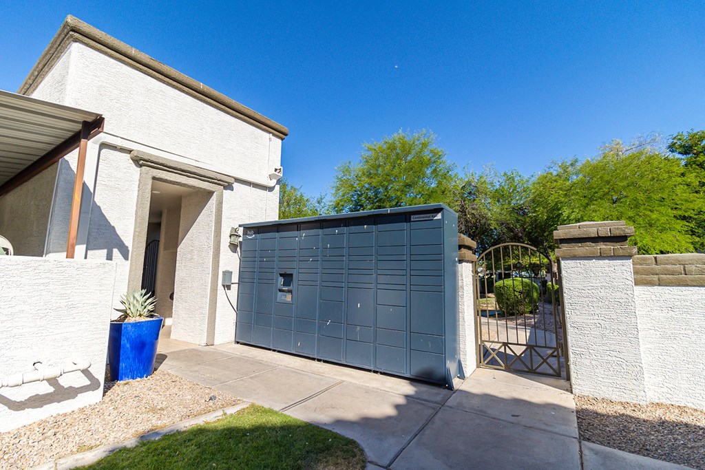 a blue garage door in front of a white house