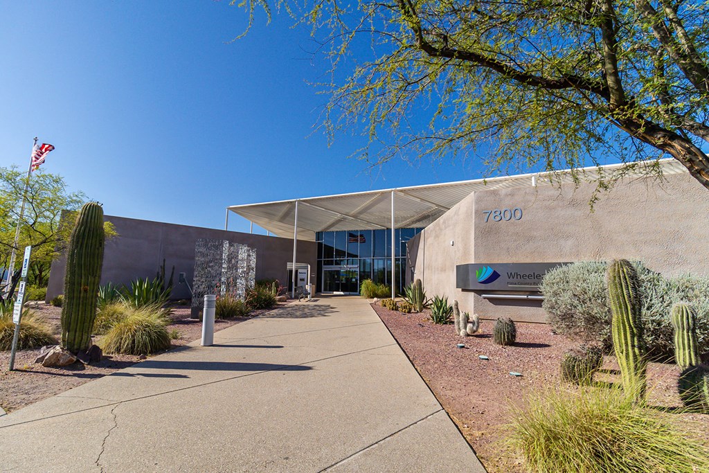 a view of the front of the building with a blue sky in the background