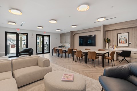 A living room with a grey couch and a coffee table.