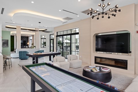 A modern living room with a fireplace and a flat screen TV.