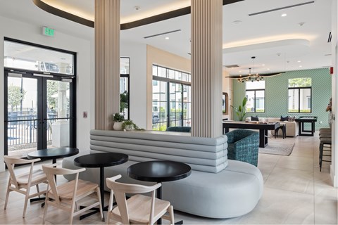 A modern cafe with wooden chairs and tables.