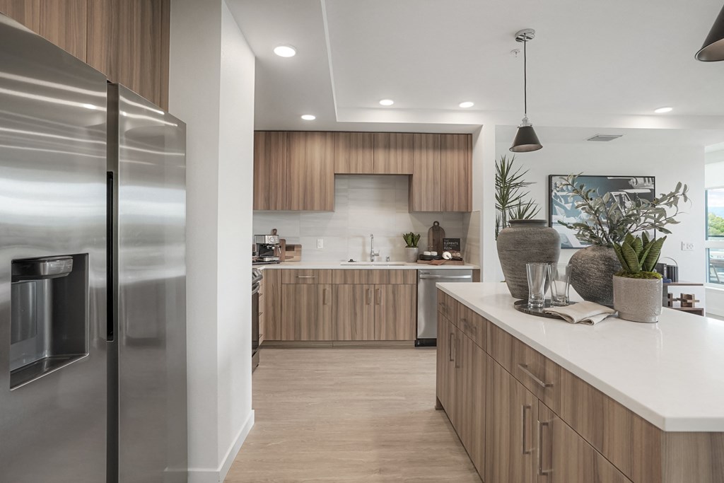 a kitchen with stainless steel appliances and wooden cabinets
