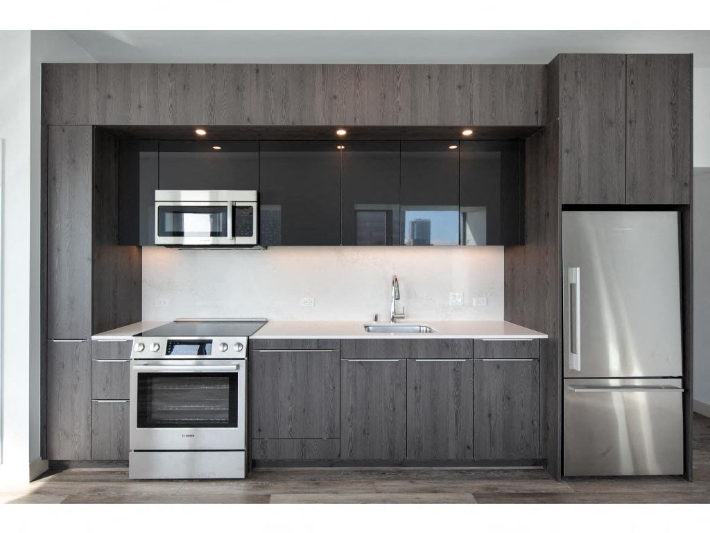 a kitchen with a stove top oven next to a refrigerator
