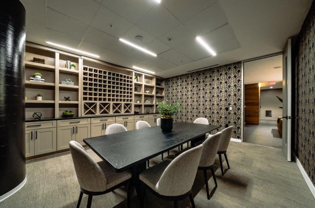a dining room with a table and chairs