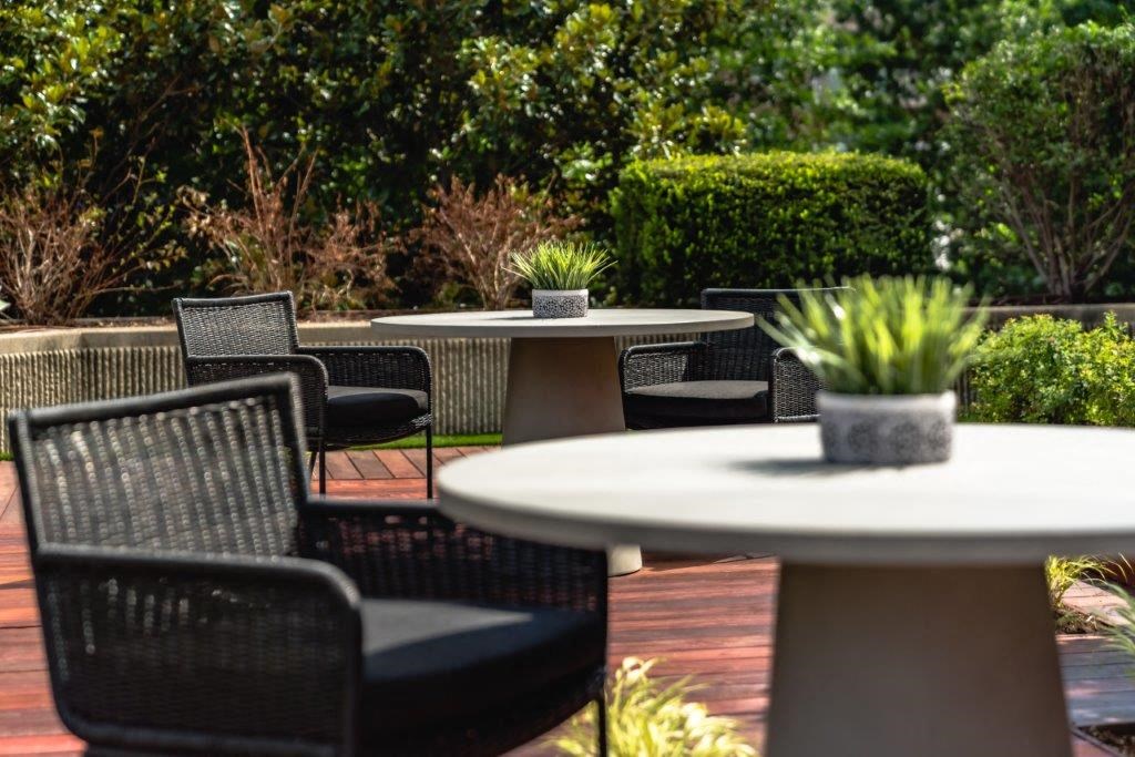 a group of tables and chairs on a patio