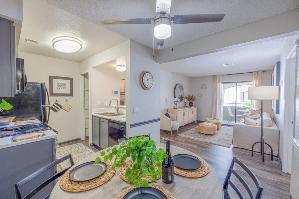 an open living room and kitchen with a dining table