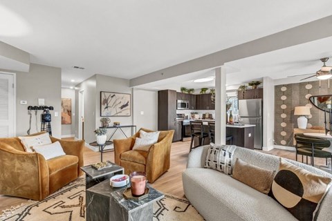 A living room with a grey couch and a coffee table.