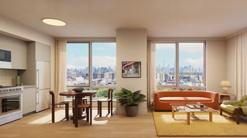 A modern kitchen with a dining table and chairs, a sofa, and a view of the city.