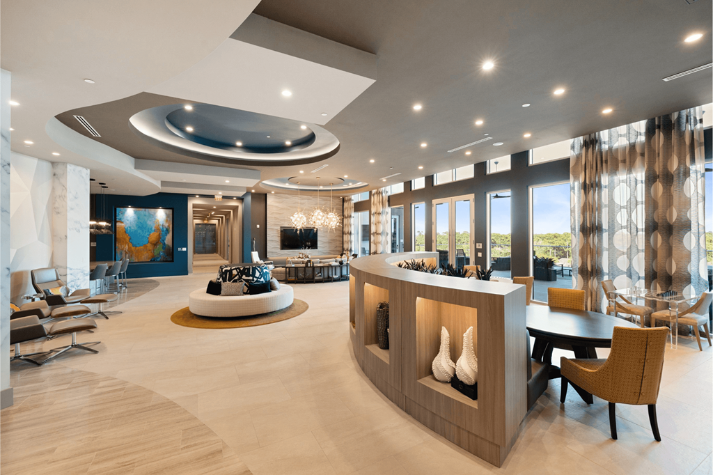 A modern living room with a curved ceiling and a fireplace.