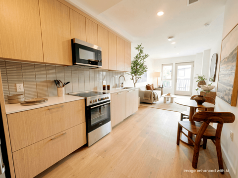 A modern kitchen with wooden cabinets and stainless steel appliances.
