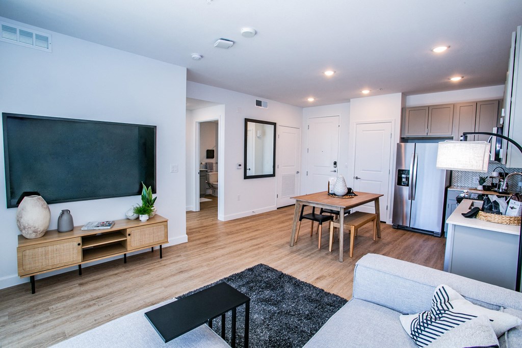 a living room with a couch and a table and a television